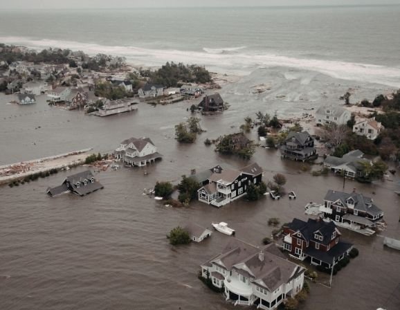 Home surrounded by floodwater as storm clouds clear
