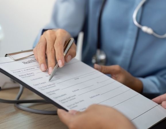A family reviewing health insurance billing statements
