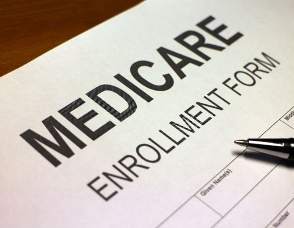 Medicare card and Social Security form on desk